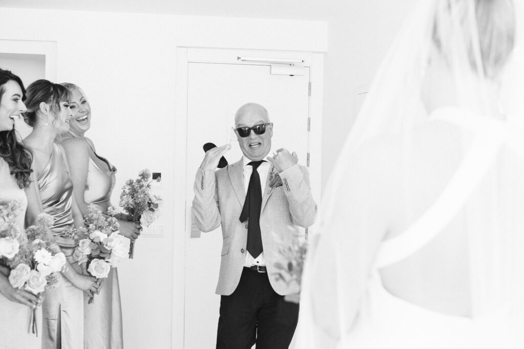 Dad seeing his daughter in her wedding dress for the first time